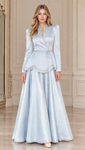 Front view of Ice Blue rhinestone embellished long sleeve peplum maxi gown