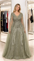 Front view of woman wearing sage green sequin cape sleeve evening gown
