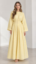 Front view of woman wearing Light Yellow long sleeve pleated waist maxi dress