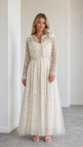 Front view of model wearing ivory floral lace maxi dress with cropped jacket