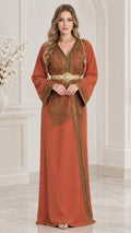 Front view of woman wearing a Rust embroidered Moroccan kaftan maxi dress with gold belt