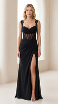 Front view of black lace-trimmed sheer corset maxi evening gown with side slit