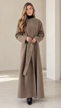 Front view of model wearing taupe maxi wrap coat with waist belt