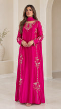 Front view of woman wearing fuchsia embroidered maxi abaya dress with matching scarf