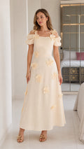 Front full view of cream floral applique cold shoulder midi dress