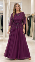 Front full view of woman wearing plum embellished sequin chiffon maxi evening gown with 3/4 sleeves