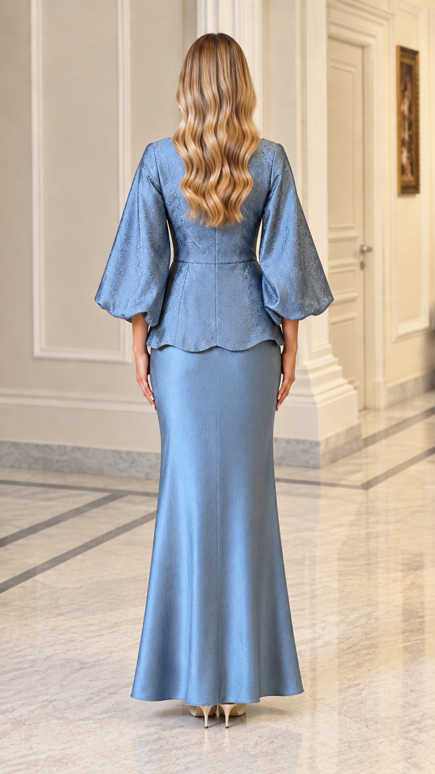 Back view of dusty blue jacquard peplum jacket and matching floor-length skirt