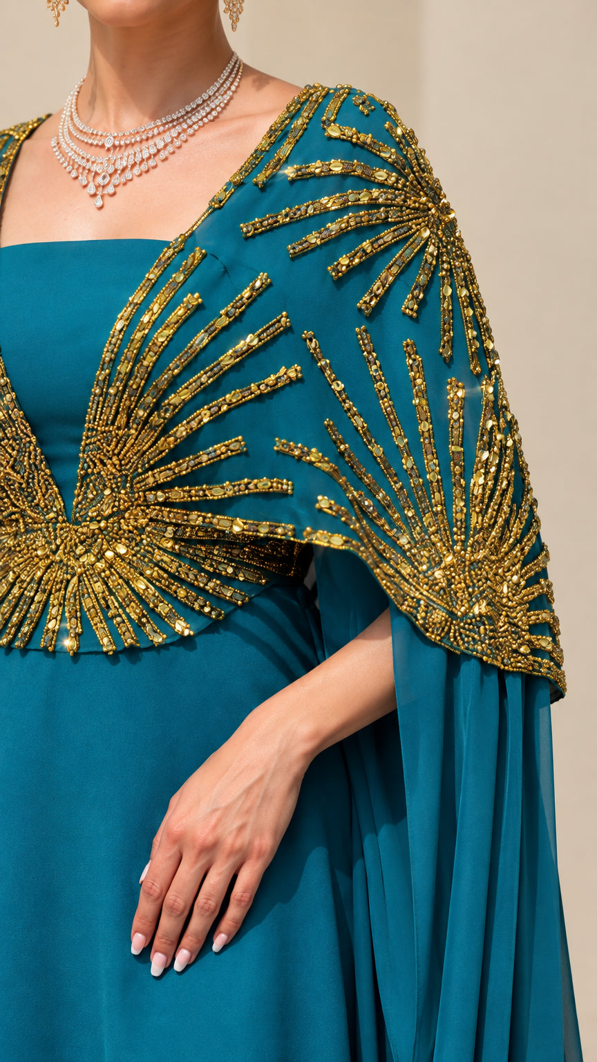 Close-up of gold sequined and beaded sunburst pattern on capelet